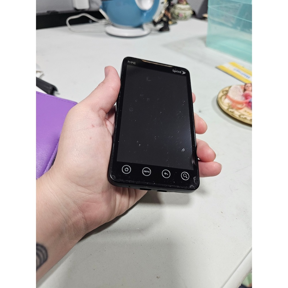 vintage HTC Evo 4G smartphone for the Sprint network stand y2k